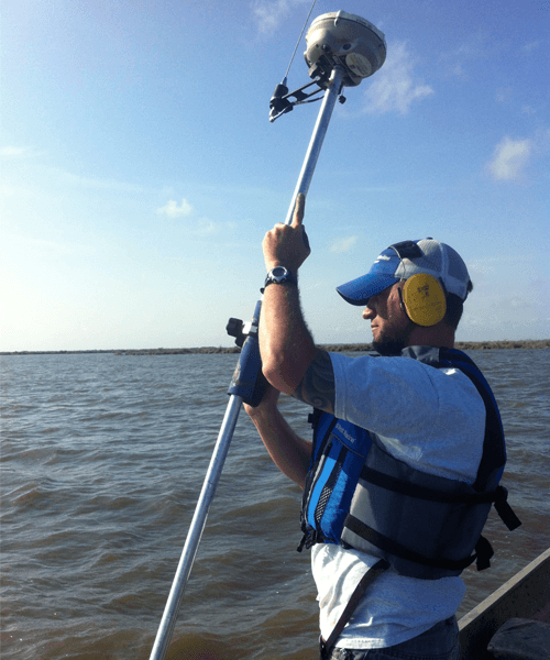 HydroTerra surveyor on the water with GPS equipment
